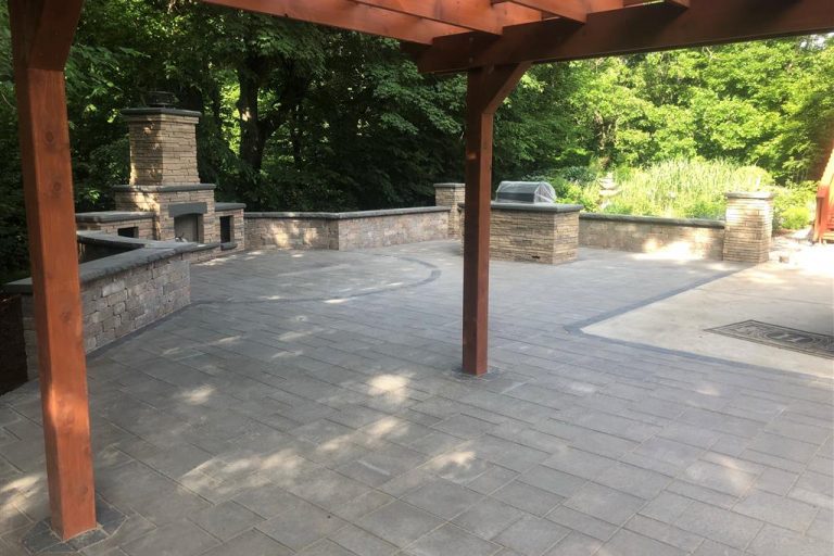 New paver patio, outdoor fireplace and grill island.